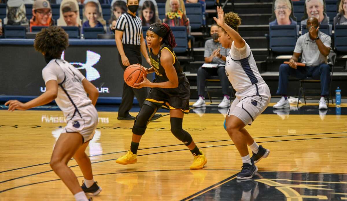 Isis Young, center, said she and her Siena teammates have managed to shake off the many pauses this season by joking about it. (Courtesy of Monmouth Athletics)