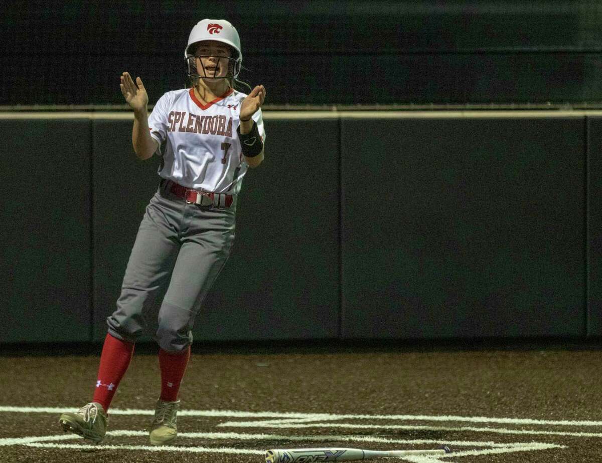 Splendora substitute runner Honor Knott (7) claps her hands after crossing home plate during a Region III-4A quarterfinal softball game at Humble High School in Humble.