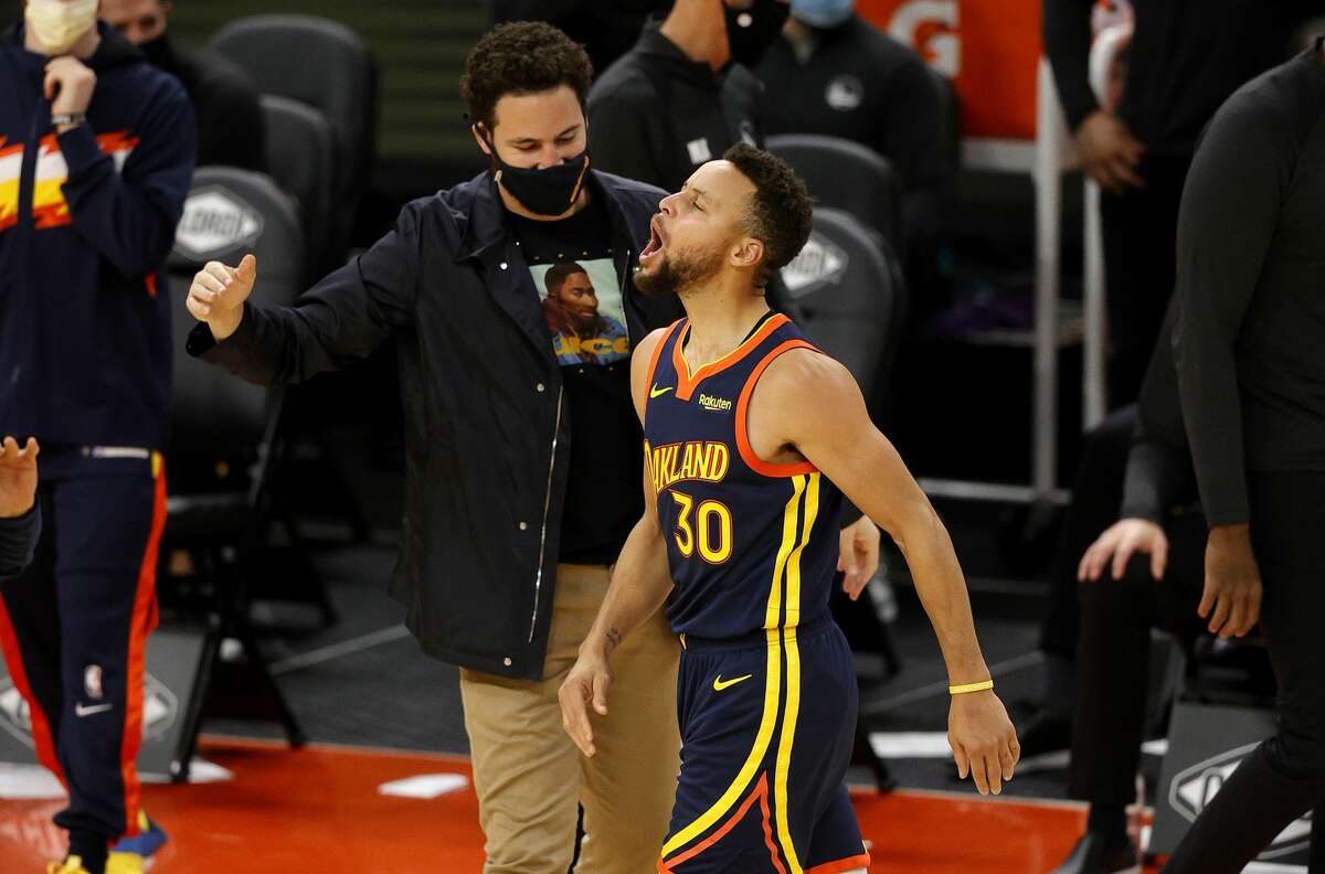 Stephen Curry of the Golden State Warriors celebrates with Klay Thompson after he made a three-point basket in the fourth quarter against the Minnesota Timberwolves.