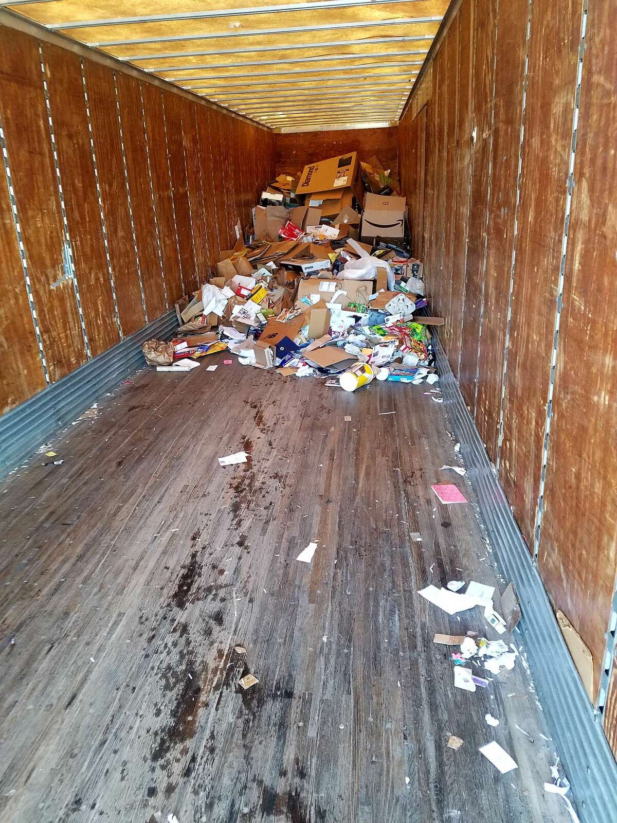 Despite space in the Manistee Central Catholic cardboard recycling trailer, resident Breanna Knudsen found piles of cardboard outside on Jan. 25.