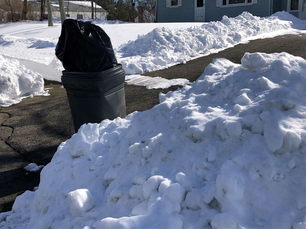 A full trash can on Ford Street in Ansonia, Conn. on Feb. 4, 2021.
