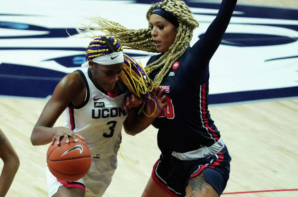 Feb 3, 2021; Storrs, Connecticut, USA; UConn Huskies forward Aaliyah Edwards (3) drives the ball against St. John's Red Storm forward Rayven Peeples (20) in the second half at Harry A. Gampel Pavilion. UConn defeated St. John's 94-62. Mandatory Credit: David Butler II-USA TODAY Sports