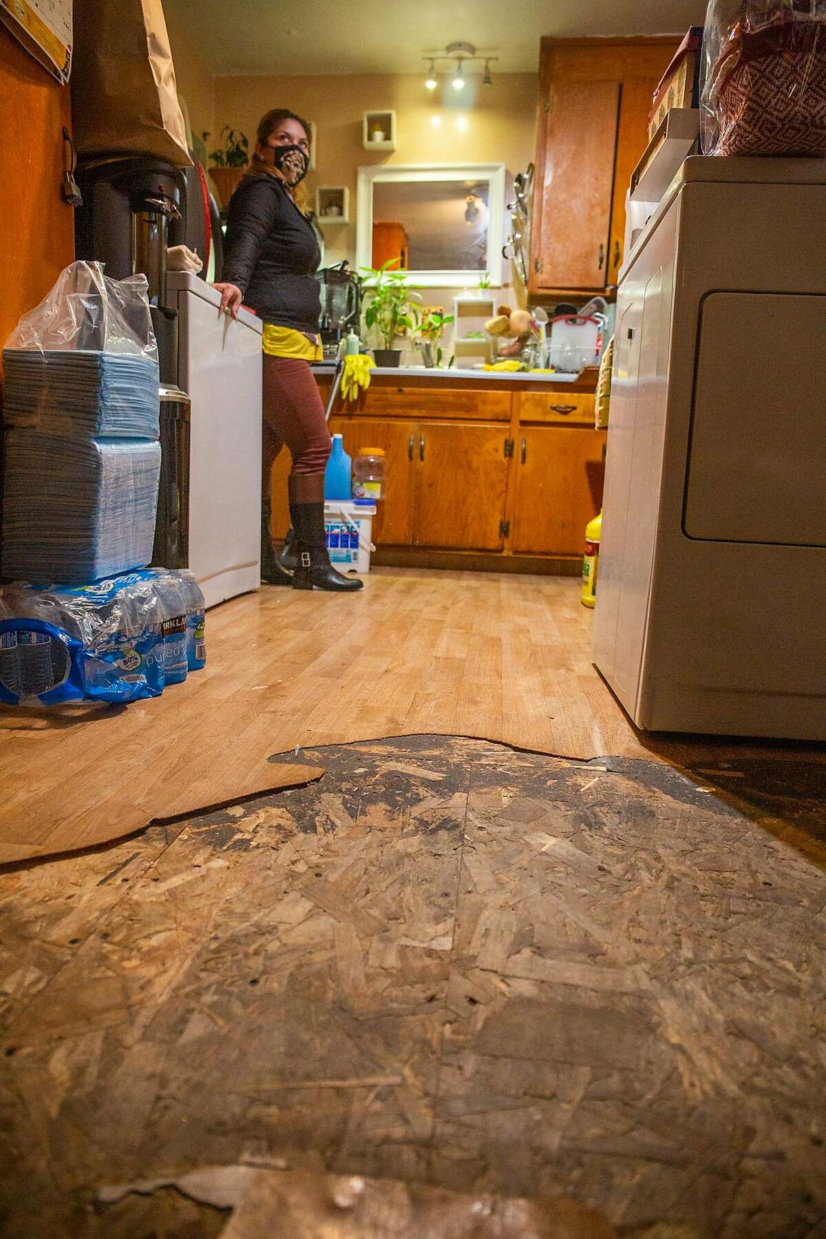 Angelica Rivas has been in her Oakland Apartment for over 16 years, her parents live next door and she lives with her three children. She has complained to the many landlords who have cycled through property ownership of the floor, the lack of light, the lack of water pressure, the cockroaches, and the rats.