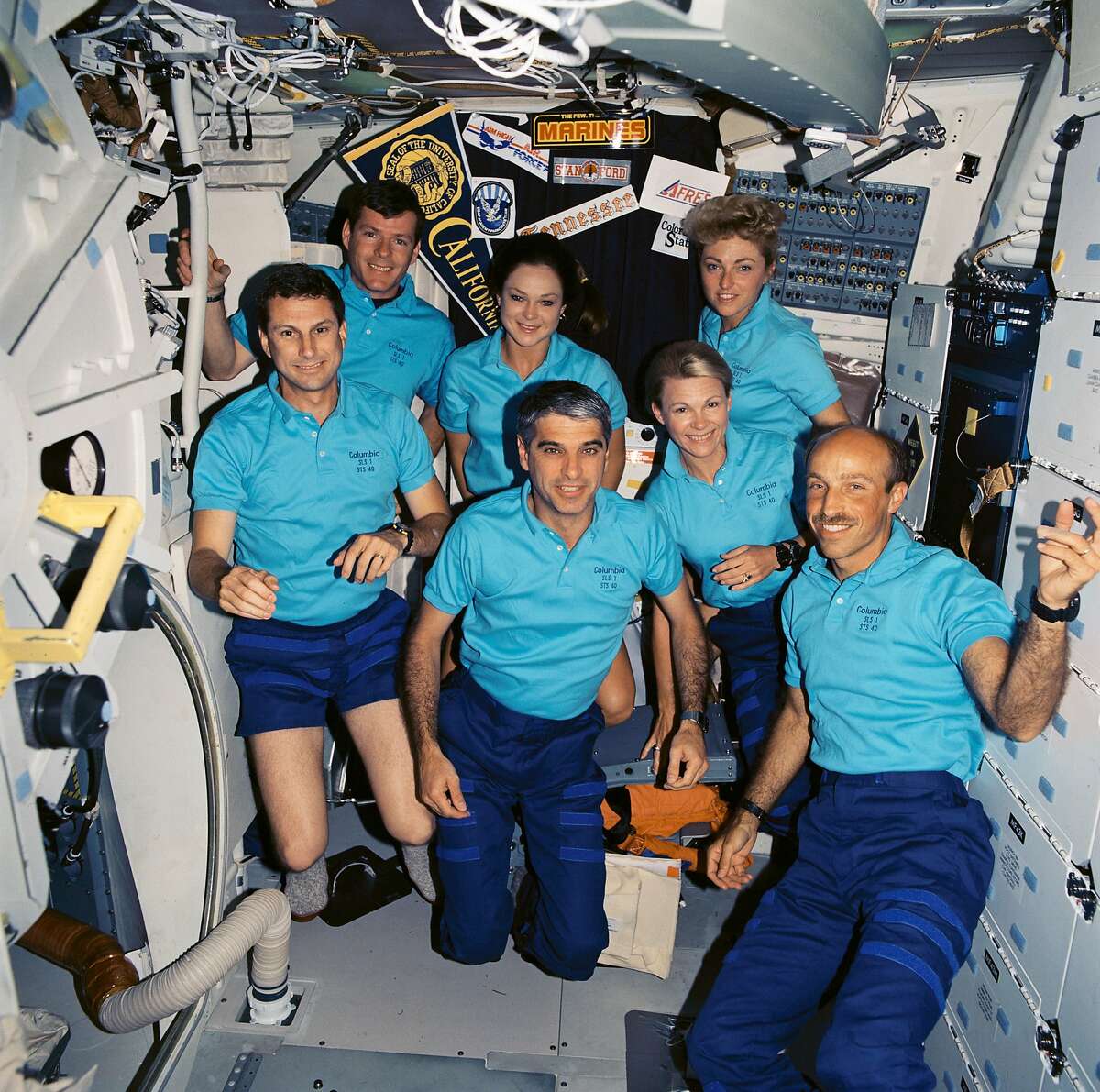The crew of the Columbia enjoying weightlessness. Millie Hughes-Fulford is in back, to the right.