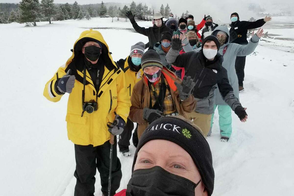 A Tauck guide takes a selfie of a group tour at Yellowstone National Park in Wyoming last month.