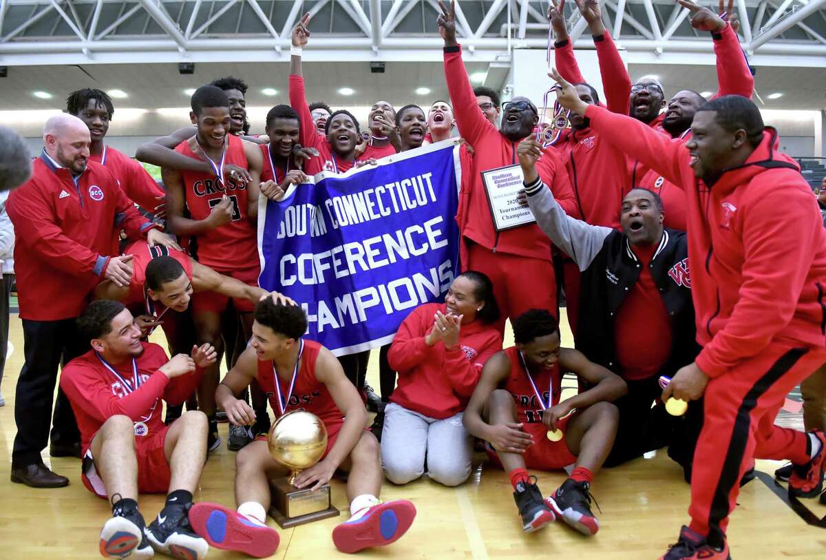 Wilbur Cross celebrates their 49-48 win over Notre Dame of West Haven in the SCC Boys Basketball Championship at the Floyd Little Athletic Center in New Haven on March 4, 2020.