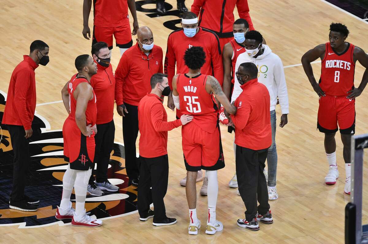 Houston Rockets center Christian Wood (35) receives attention sustaining an injury in the second half of an NBA basketball game against the Memphis Grizzlies Thursday, Feb. 4, 2021, in Memphis, Tenn. (AP Photo/Brandon Dill)