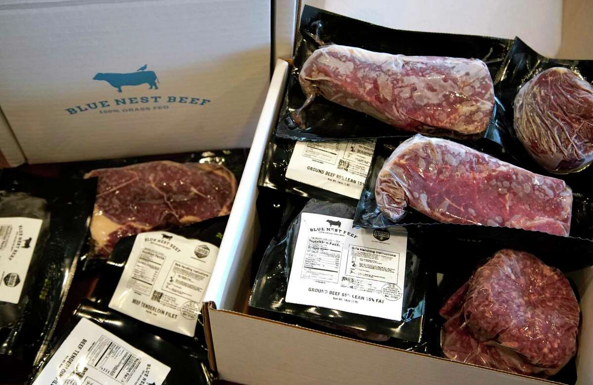 Packages of Blue Nest Beef frozen steaks and ground beef are shown at the office of Russ Conser, chief executive and impact officer, Monday, Jan. 18, 2021 in Fulshear. Blue Nest Beef is a direct-to-consumer beef delivery company. The company partners with cattle ranchers who use regenerative farming practices certified by the National Audubon Society in the Audubon Conservation Ranching program.