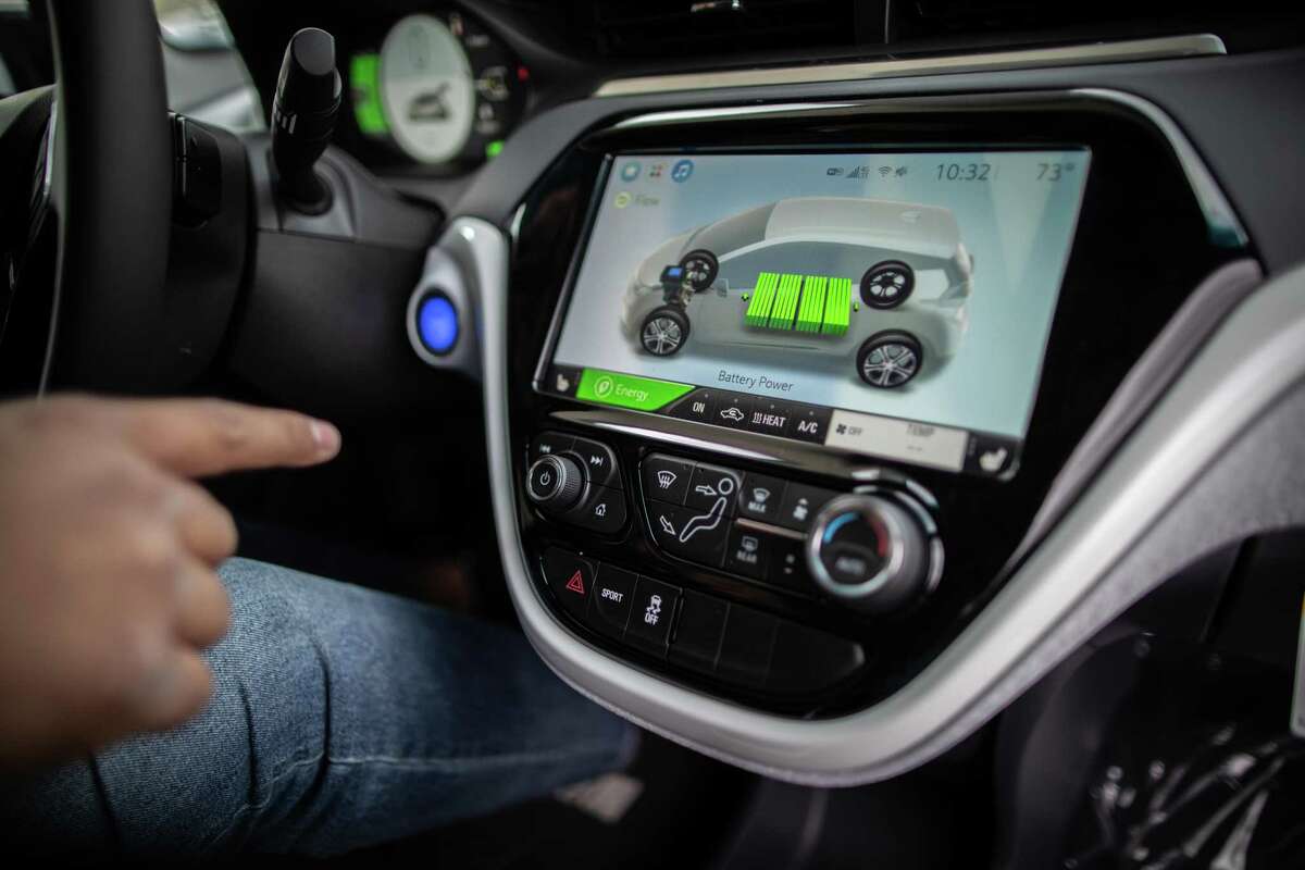 Classic Chevrolet Sugar Land sales consultant Edward Jackson Davis shows the battery level on the dash screen of a Chevrolet Bolt EV, Thursday, Feb. 4, 2021, in Sugar Land. The Bolt EV is a front-motor, five-door all-electric car.