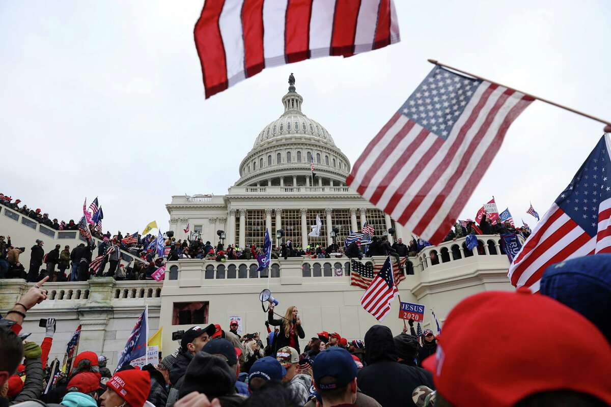 In this Wednesday, Jan. 6, 2021 file photo, supporters of President Donald Trump gather outside the U.S. Capitol in Washington. (AP Photo/Shafkat Anowar)