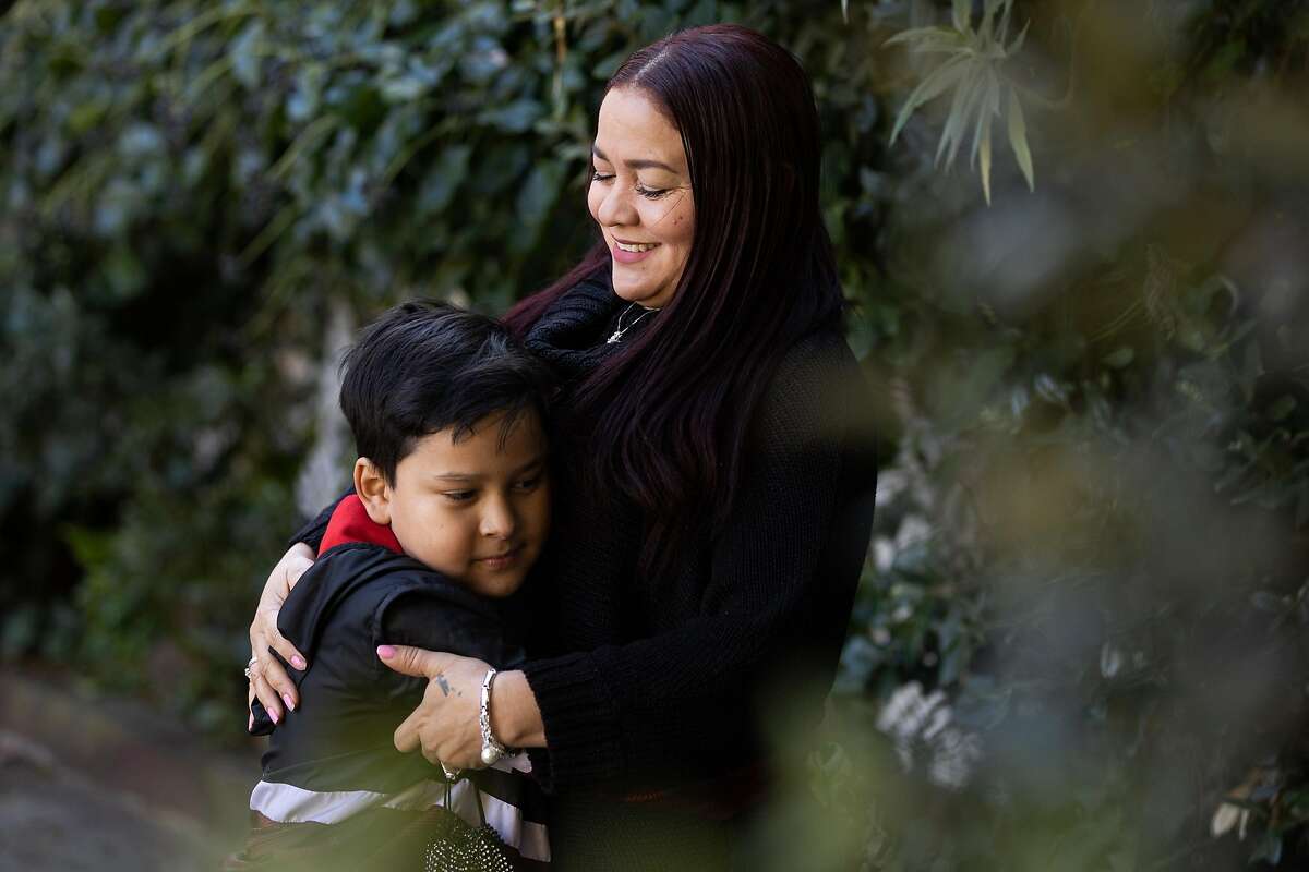 Victoria Vega, shown with her son Bryant Aleman, struggled for months to apply for unemployment benefits in Spanish. A budget proposal would increase EDD’s ability to help the 7 million Californians who speak a language other than English.