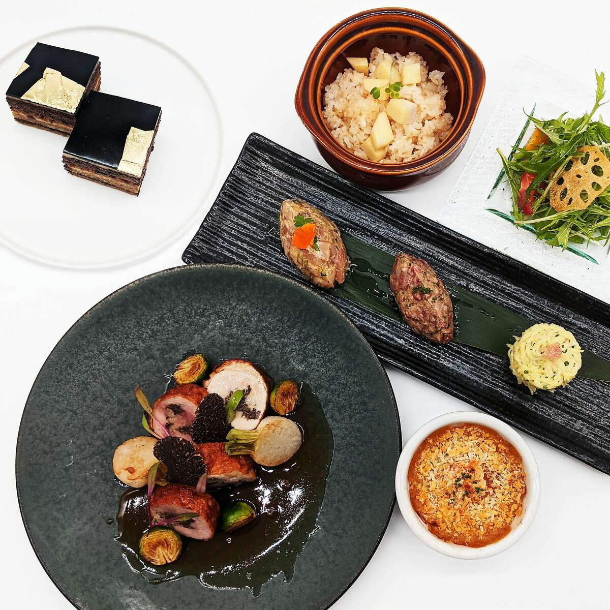 The spread of dishes for Fish & Bird Sousaku Izakaya's five-course Valentine's Day menu, including guinea fowl ballotine and tartare three days.