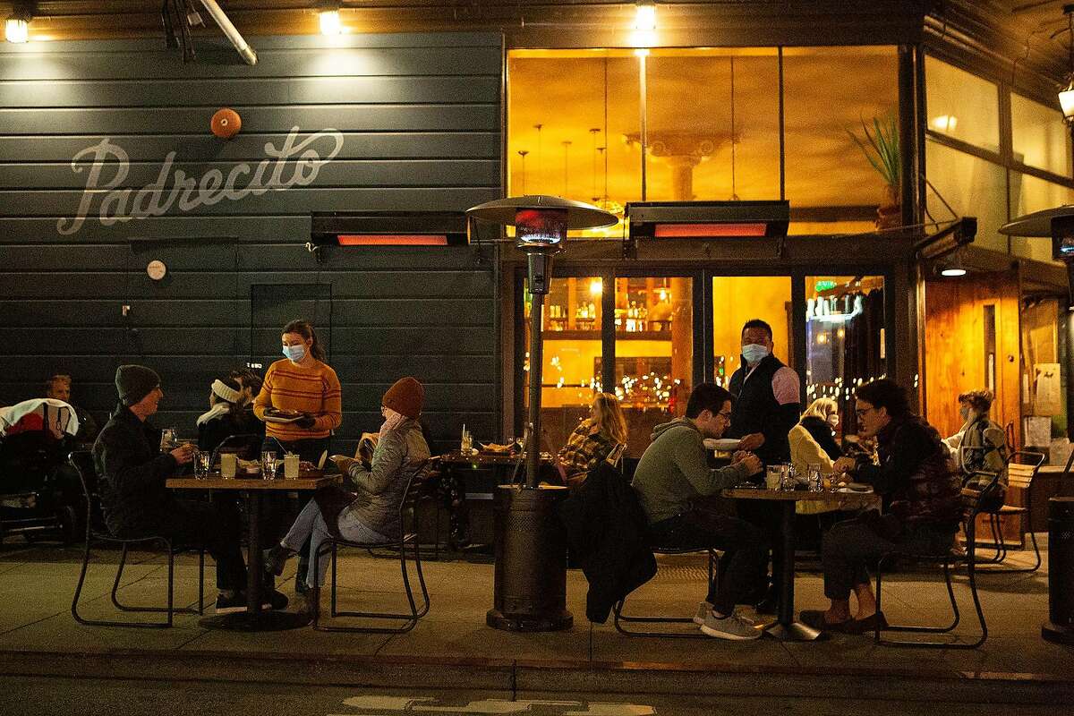 Padrecitos serves patrons outdoors in San Francisco, which reached the red tier of the state’s guidelines this week.