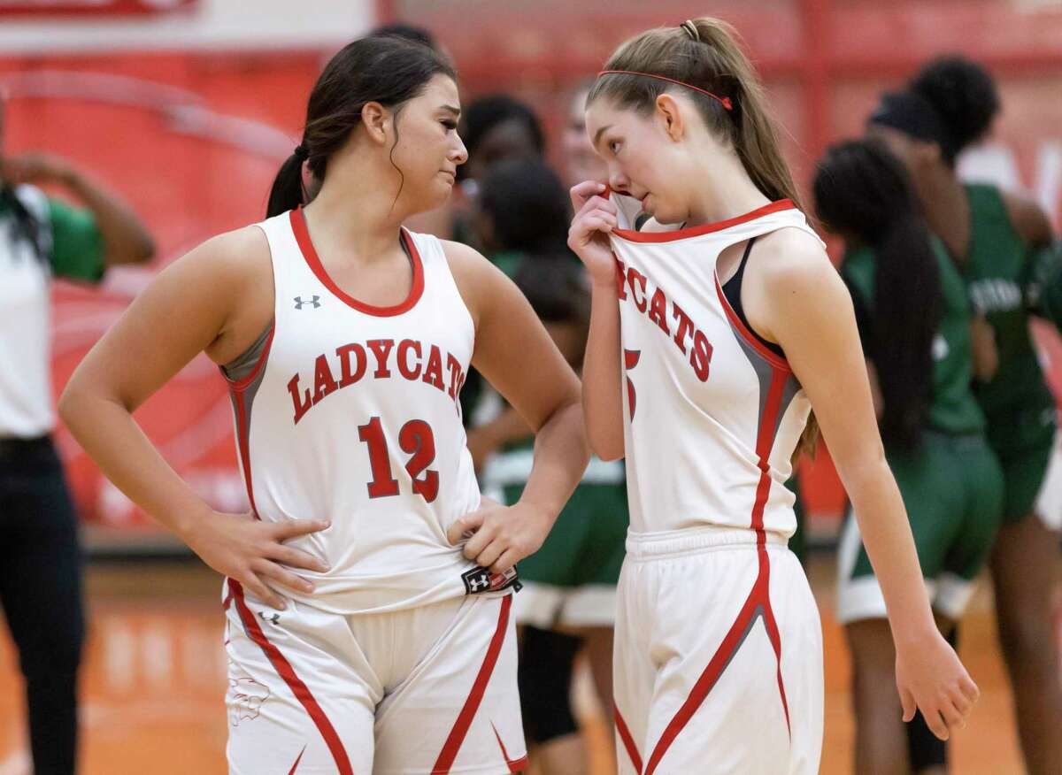 Splendora Mykala Moore (12) and Melaney Owens (5) react after they lose during overtime of a District 21-4A girls basketball game at Splendora High School, Friday, Feb. 5, 2021, in Splendora. Splendora will be out for the rest of the season.