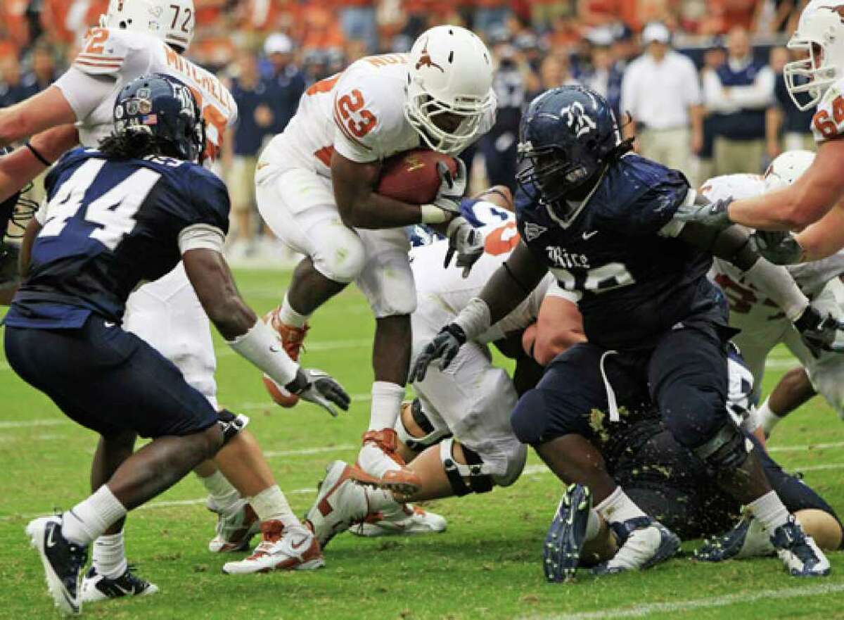 Texas tailback Tre’ Newton runs for one of his three touchdowns in Saturday’s win over Rice. He will be the starter this week.