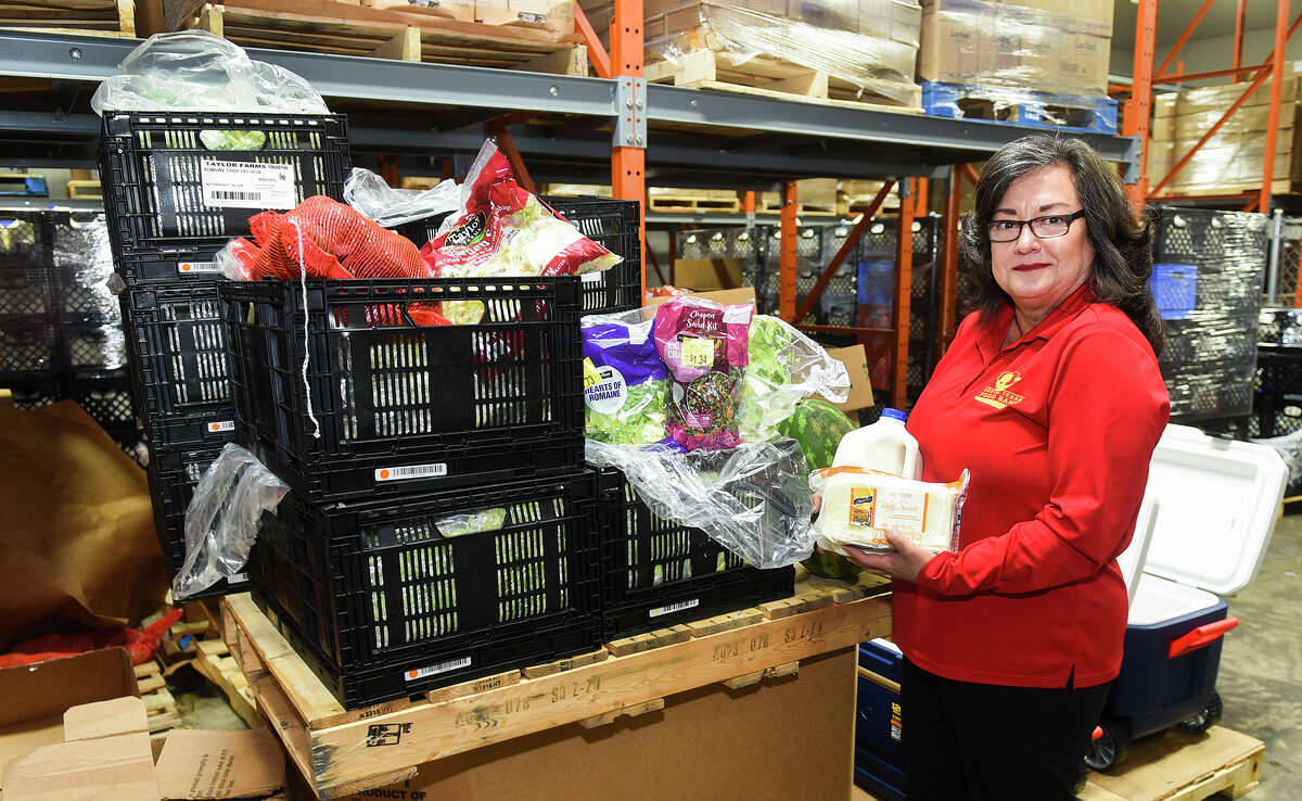 South Texas Food Bank Executive Director Alma Boubel poses for a photo, Friday, Jun 6, 2020, at the South Texas Food Bank, with some produce to be given out during the STFB'sÂ  COVID-19 Emergency Distribution today at the Sames Auto Arena.