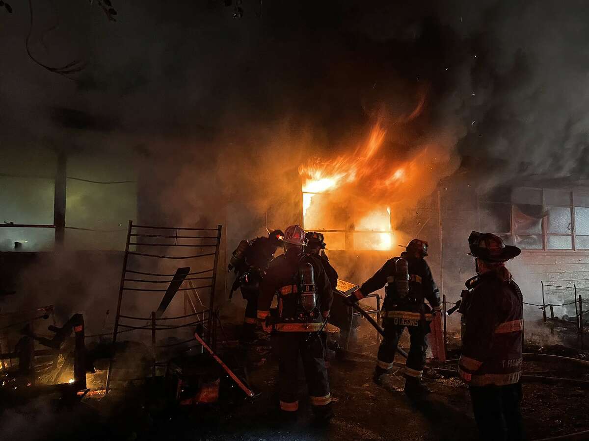 An early morning fire on Saturday that started at a homeless camp caused extensive damage to an Oakland community center.
