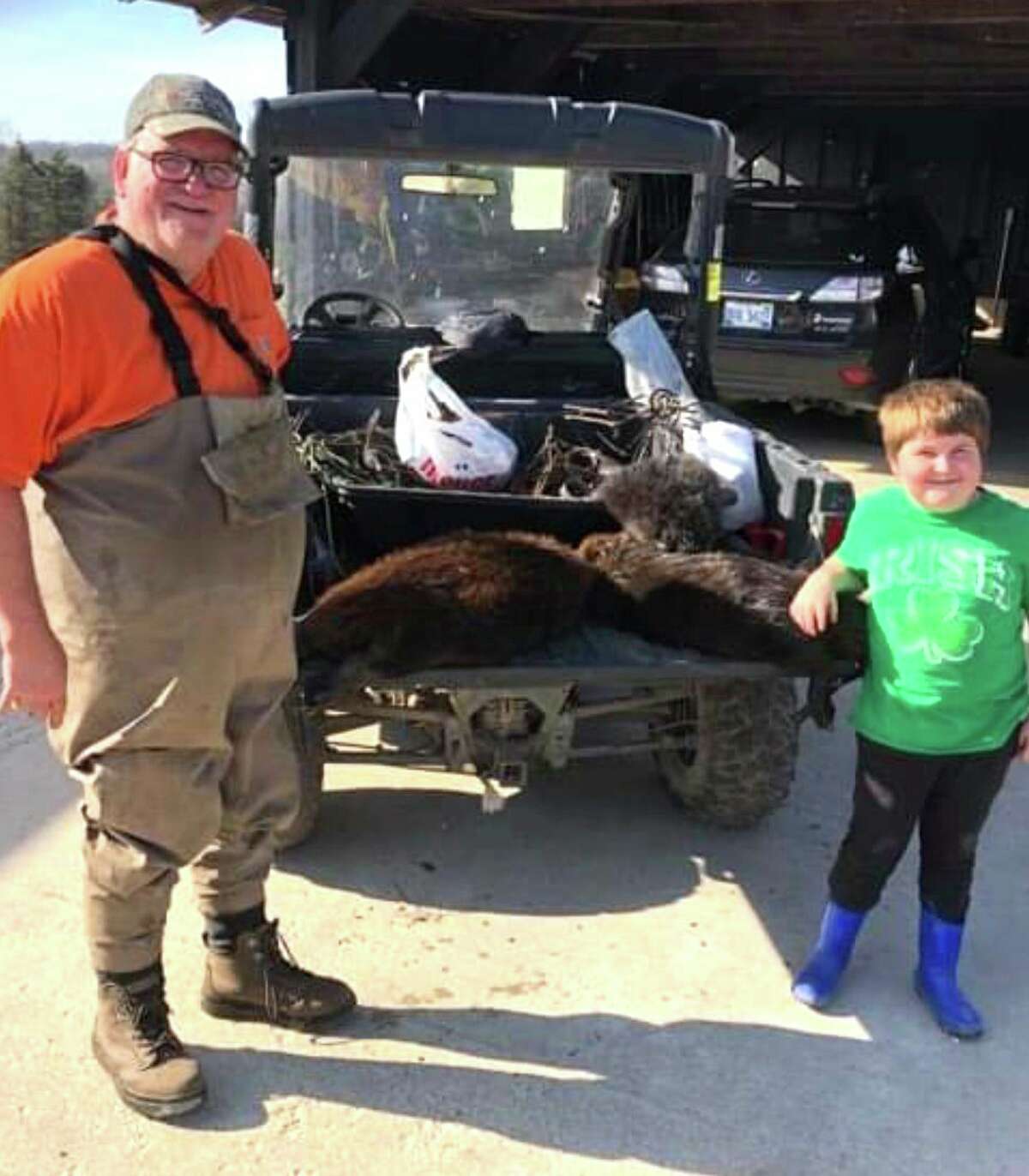 During his spare time, Jeff Hotsinpiller enjoys trapping. Here, he is pictured with grandson Peyton Whitted with a few beavers they trapped last November. (Courtesy photo)
