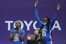 UCLA guard Charisma Osborne (20) and forward Michaela Onyenwere (21) react from the bench during the second half of an NCAA college basketball game against Washington, Sunday, Feb. 7, 2021, in Seattle. (AP Photo/Ted S. Warren)
