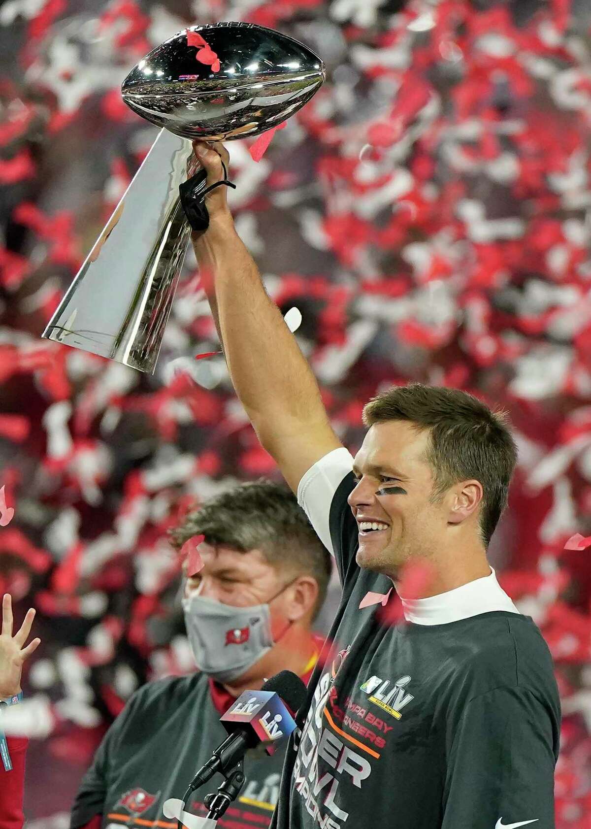 Tampa Bay Buccaneers quarterback Tom Brady celebrates with the Vince Lombardi Trophy after the NFL Super Bowl 55 football game against the Kansas City Chiefs Sunday, Feb. 7, 2021, in Tampa, Fla. The Buccaneers defeated the Chiefs 31-9 to win the Super Bowl. (AP Photo/Gregory Bull)