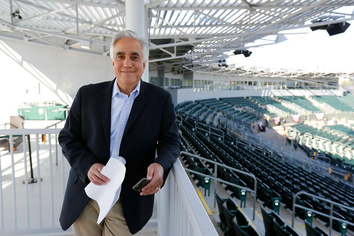 Pedro Gomez of ESPN stands in the stands prior to the game between the Oakland Athletics and the San Francisco Giants at Hohokam Stadium on March 3, 2015 in Mesa, Arizona.