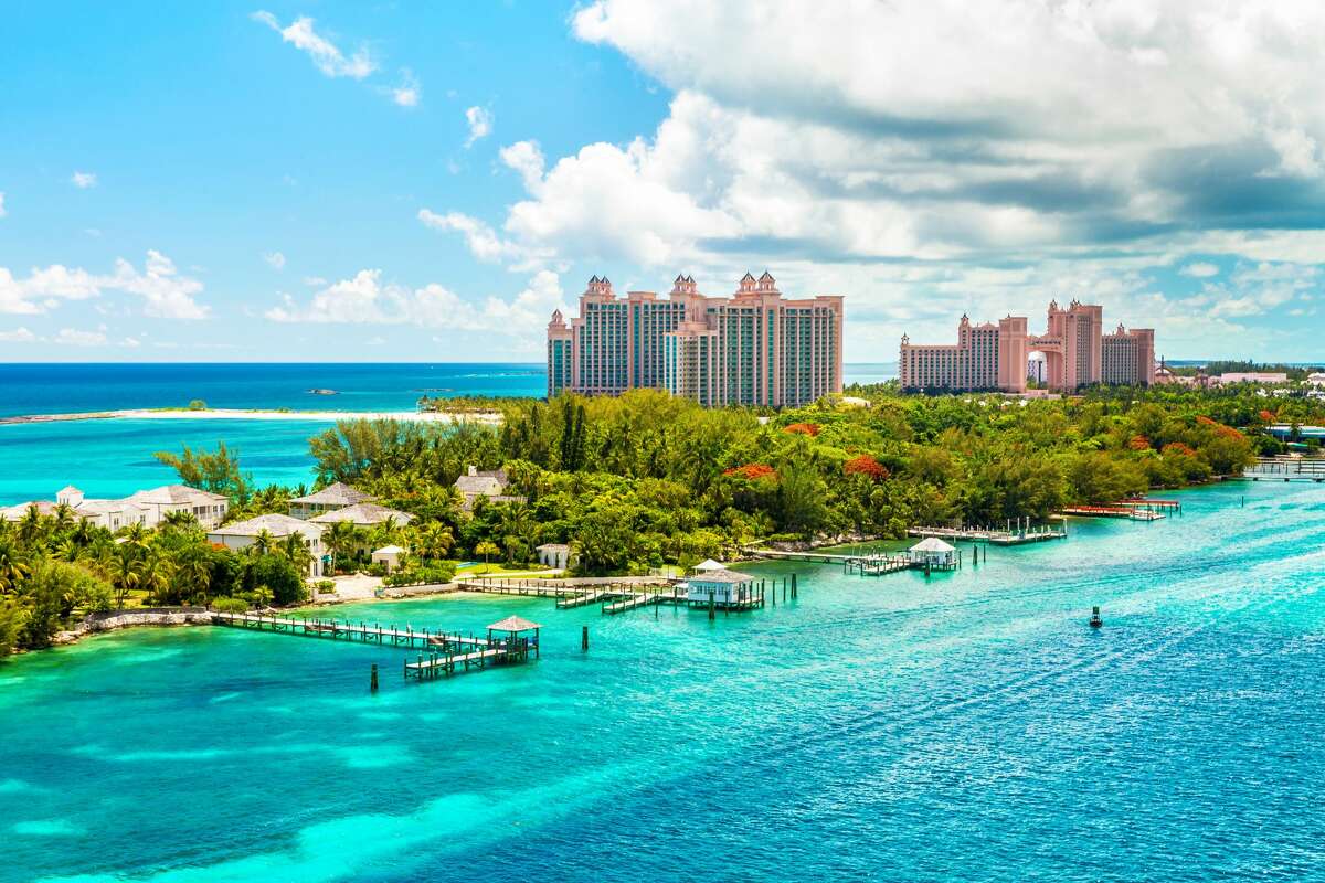 Atlantis Caribbean beach resort at Nassau with white sand coastline and deep blue sea, Bahamas.