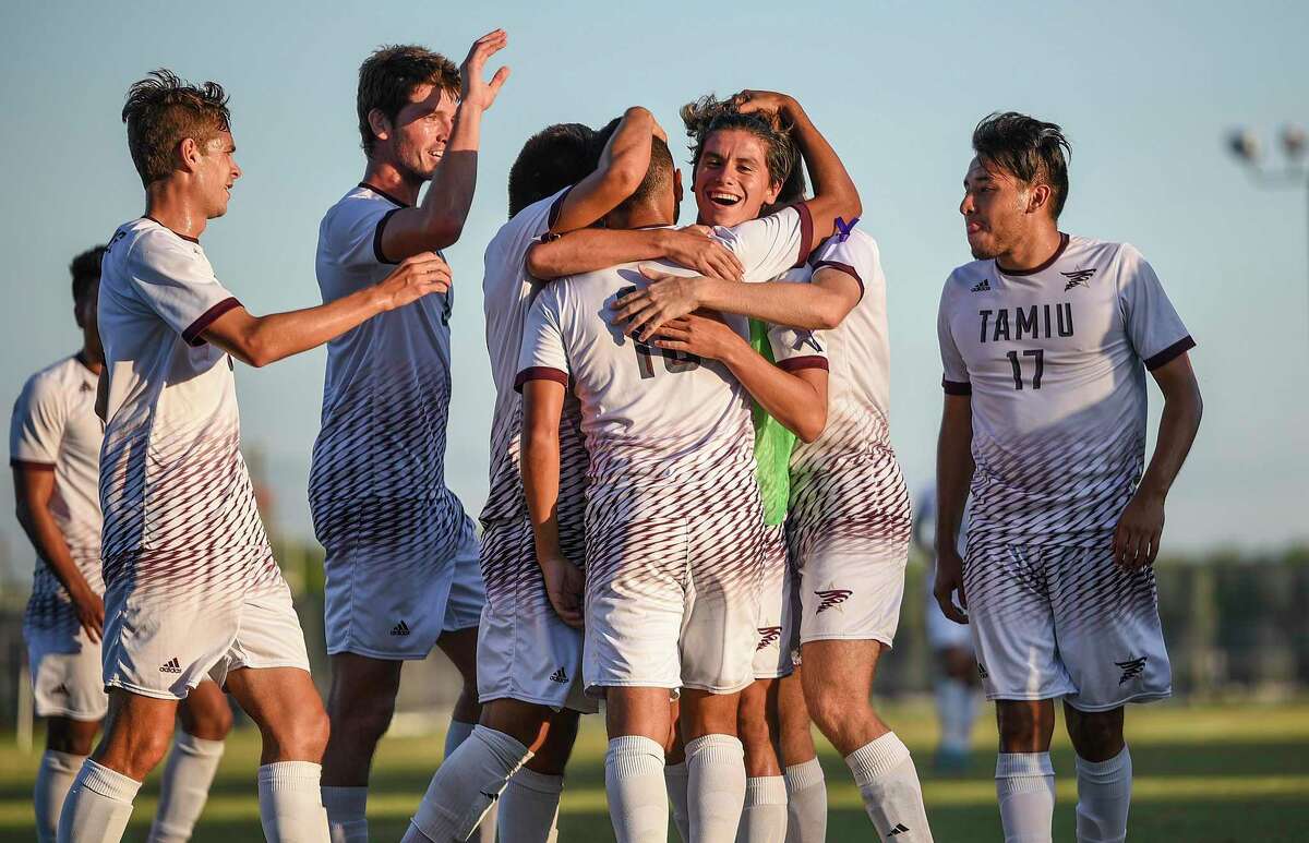 TAMIU soccer celebrates after scoring a goal against Rogers State in 2017.