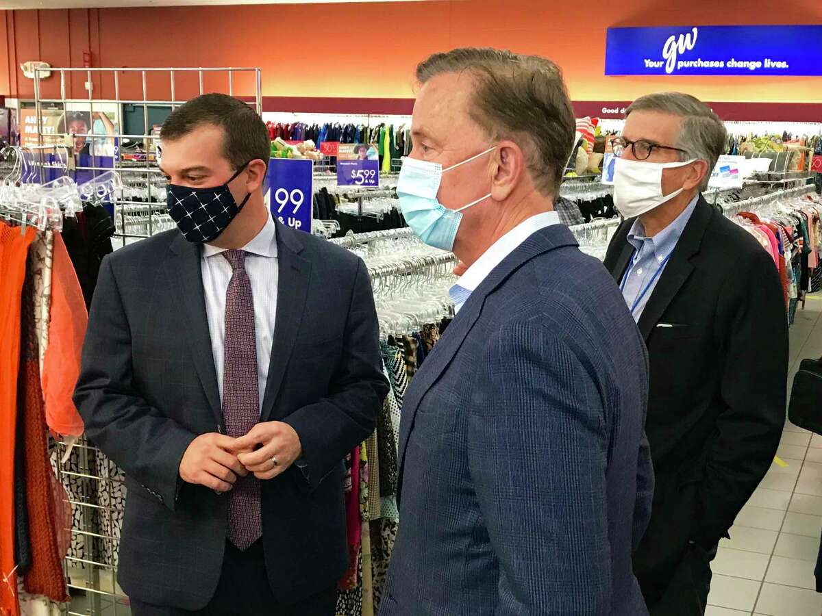 Gov. Ned Lamont, center, in October 2020 alongside Goodwill Industries of Western and Northern Connecticut's interim CEO Jeff Wieser, right, and state Rep. Steve Stafstrom at a Goodwill thrift store in Bridgeport, Conn. (Press photo via Goodwill Industries of Western and Northern Connecticut)