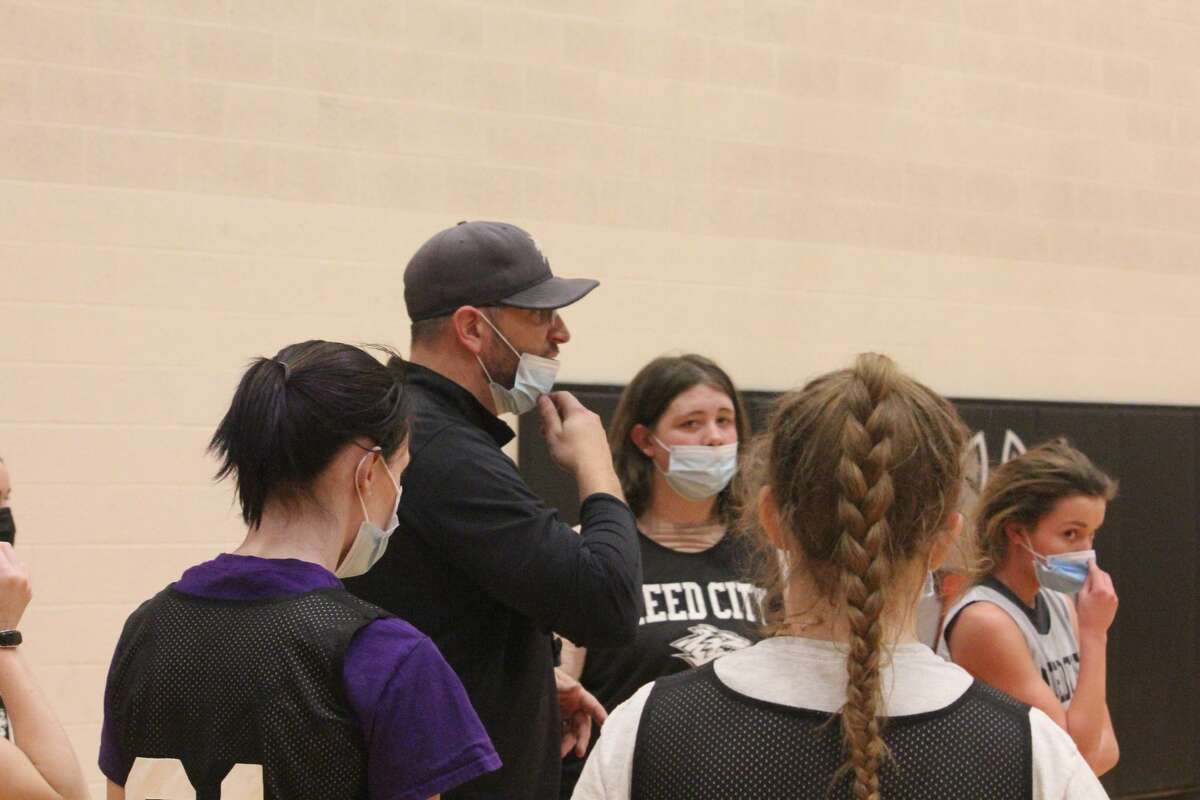 Reed City girls' basketball coach Tim Beilfuss speaks to his players at a recent practice. (Pioneer photo/John Raffel)