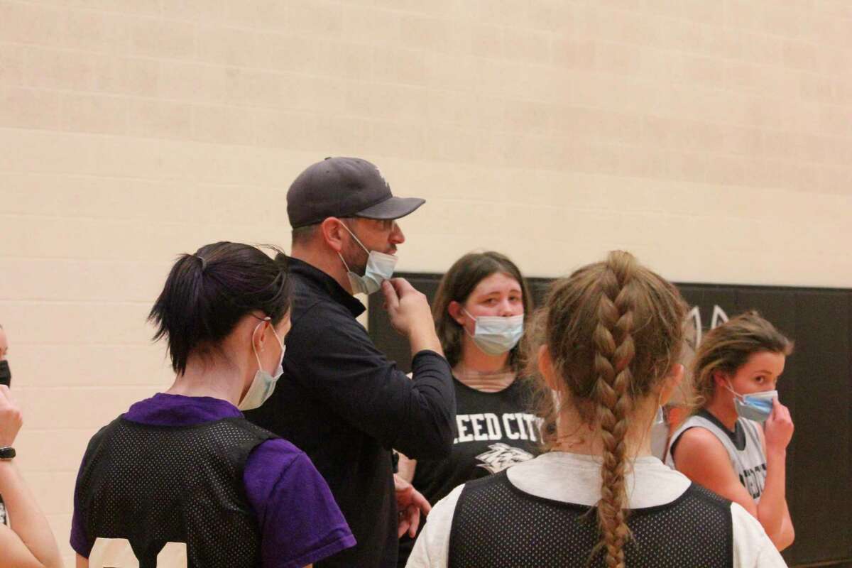 Reed City girls' basketball ccoach Tim Beilfuss speaks to his players at a recent practice. (Pioneer photo/John Raffel)