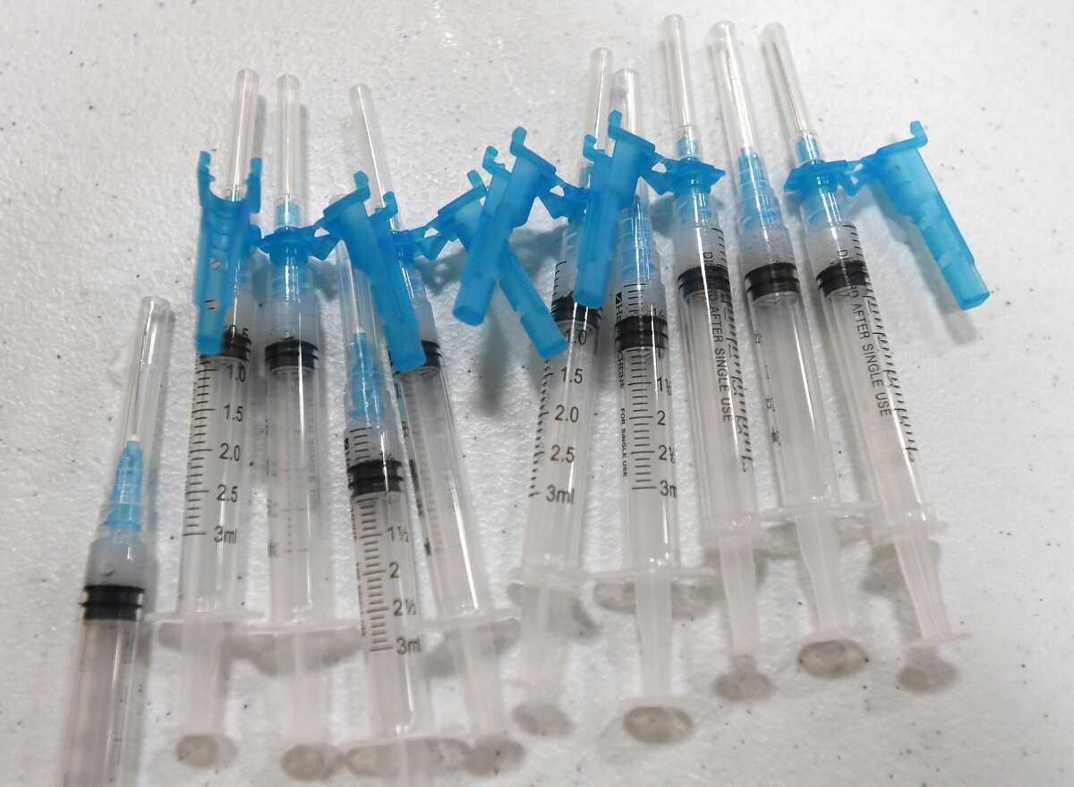 Syringes ready to use sit among a tableful of supplies during Hardin County's Monday morning COVID-19 vaccine clinic in Lumberton. The county is holding clinics as vaccine becomes available and trying to reach residents throughout the county by staging them at different locations. Photo taken Monday, February 8, 2021 Kim Brent/The Enterprise