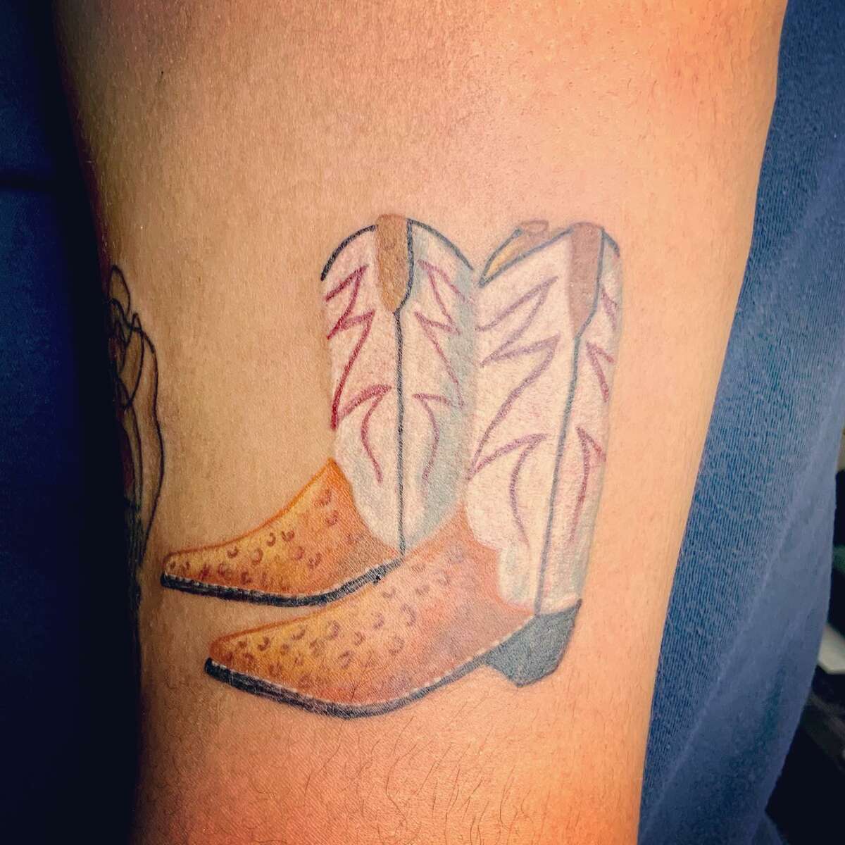 North Star Mall's pair of gigantic cowboy boots have a tiny, tattooed twin on the arm of a San Antonio woman.