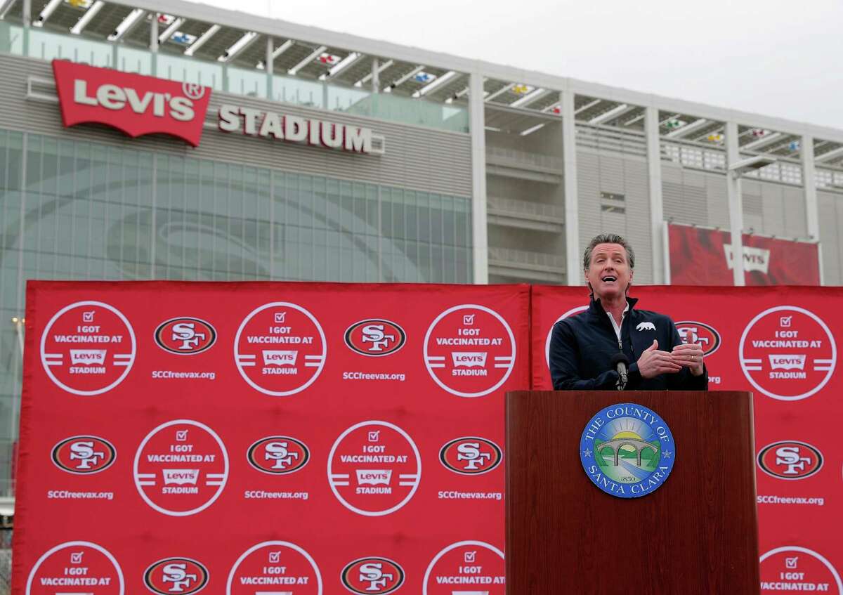 California Gov. Gavin Newsom speaks at Levi’s Stadium on Tuesday as the mass-vaccination site opened.