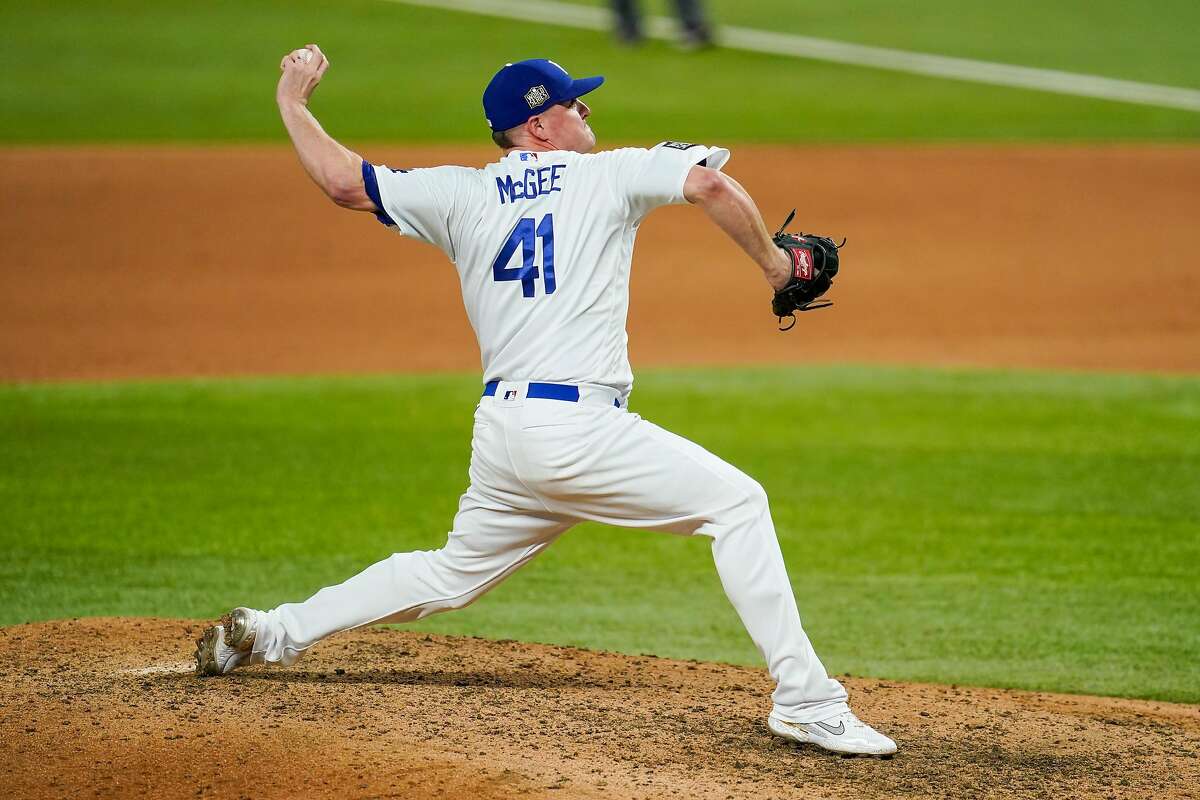 ARLINGTON, TX - OCTOBER 21: Jake McGee #41 of the Los Angeles Dodgers pitches in the ninth inning during Game 2 of the 2020 World Series between the Los Angeles Dodgers and the Tampa Bay Rays at Globe Life Field on Wednesday, October 21, 2020 in Arlington, Texas. (Photo by Cooper Neill/MLB Photos via Getty Images)