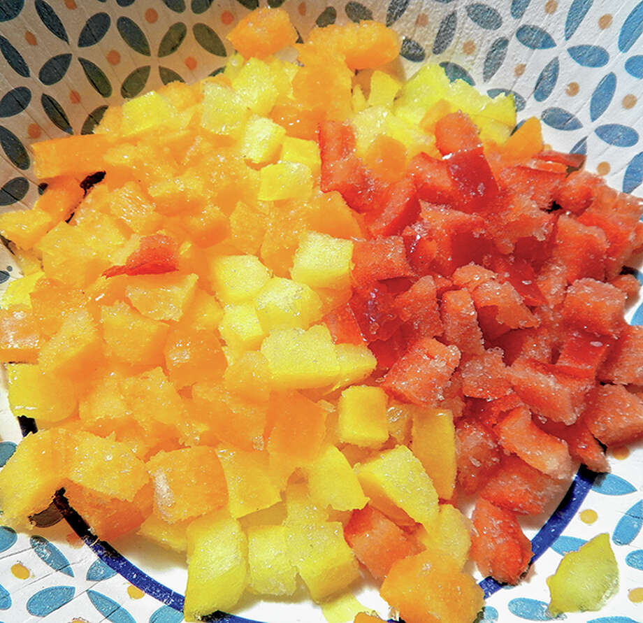 A blend of chopped red, orange and yellow peppers fills in for green peppers in an impromptu gumbo-making session. Photo: Angela Bauer | Journal-Courier 