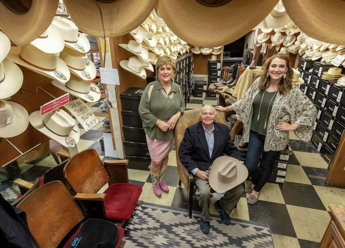 Paris Hatters owners Myrna, left, and Abe, center, Cortez pose with their daughter Alexandra Cortez Sledge inside the downtown San Antonio institution.