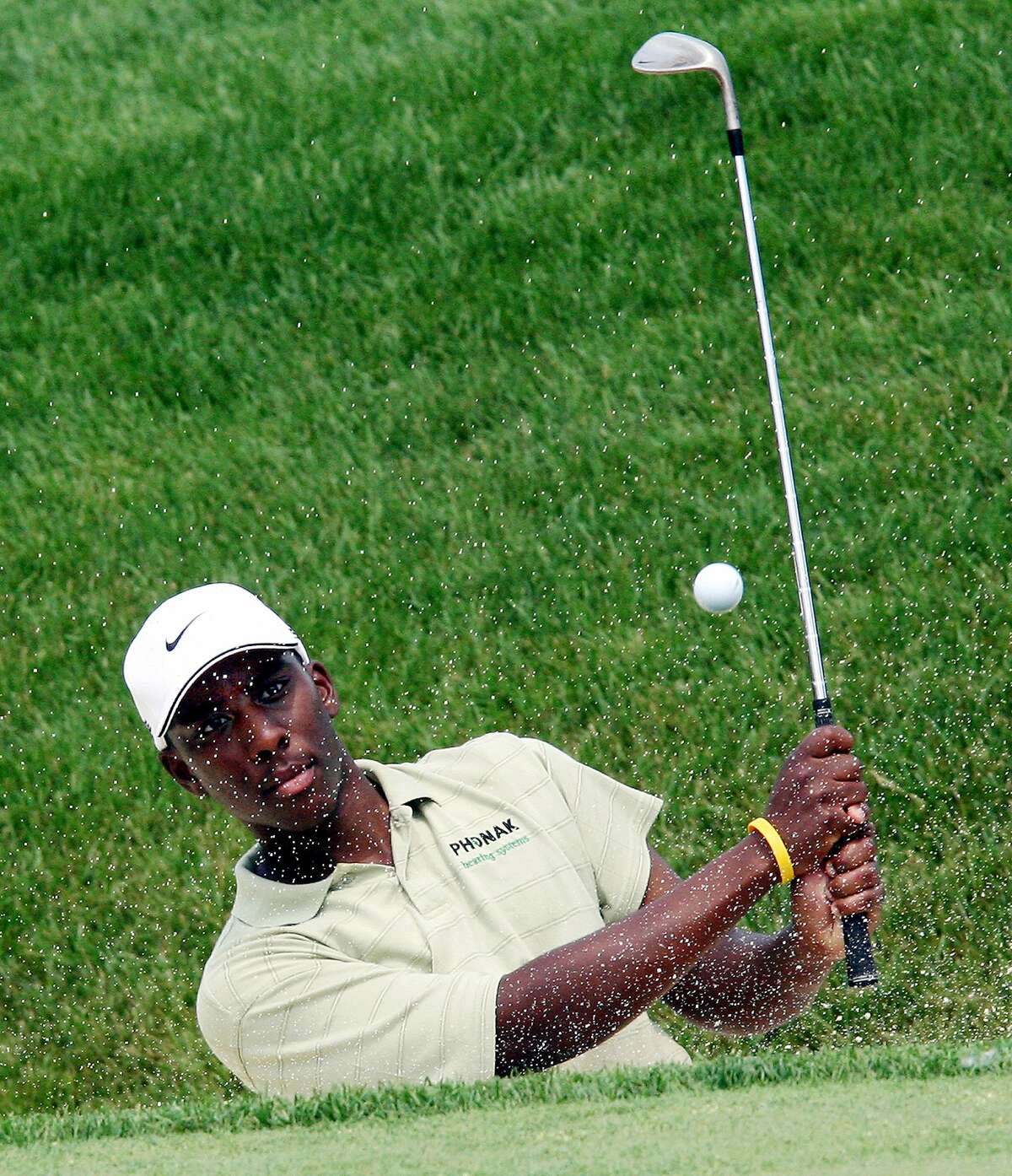Former Ohio State golfer Kevin Hall hits out of the bunker on the 18th hole during a practice round at the 2006 Memorial golf tournament at the Muirfield Village Golf Club, Tuesday, May 30, 2006, in Dublin, Ohio (AP Photo/Terry Gilliam)