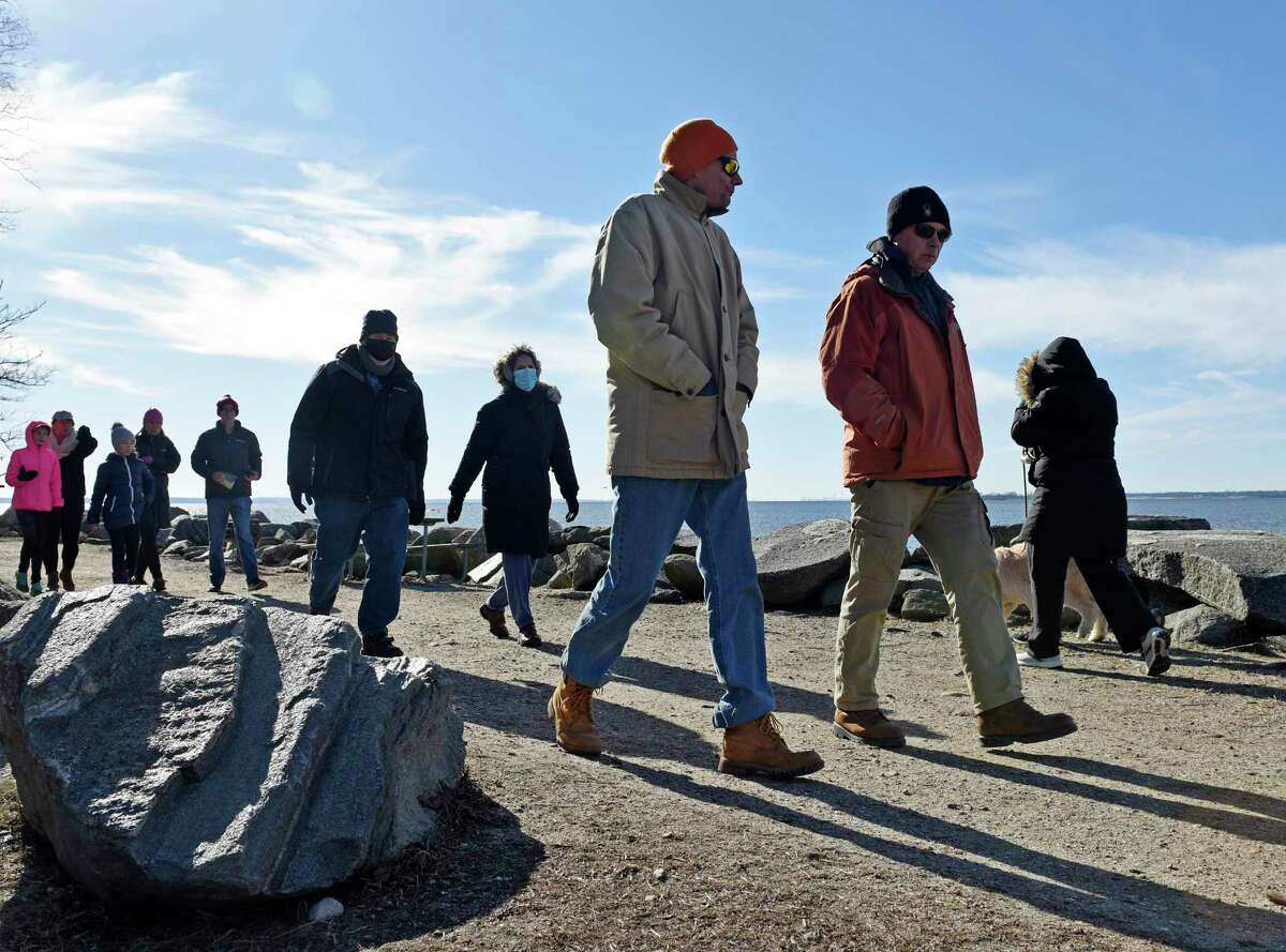 A mass of people walk the Tod’s Driftway loop at Greenwich Point Park in Old Greenwich, Conn. Sunday, Jan. 10, 2021.