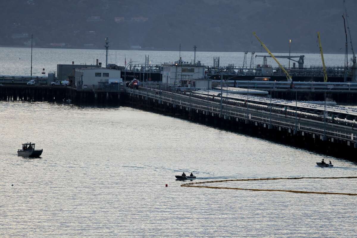 The crews of Chevron and the fire department respond to a leak of petroleum products at a rate of 5 gallons per minute in the waters of Point Richmond when an absorbent next to the Chevron Richmond Long Wharf in Richmond, Calif Boom will be installed in 2021.