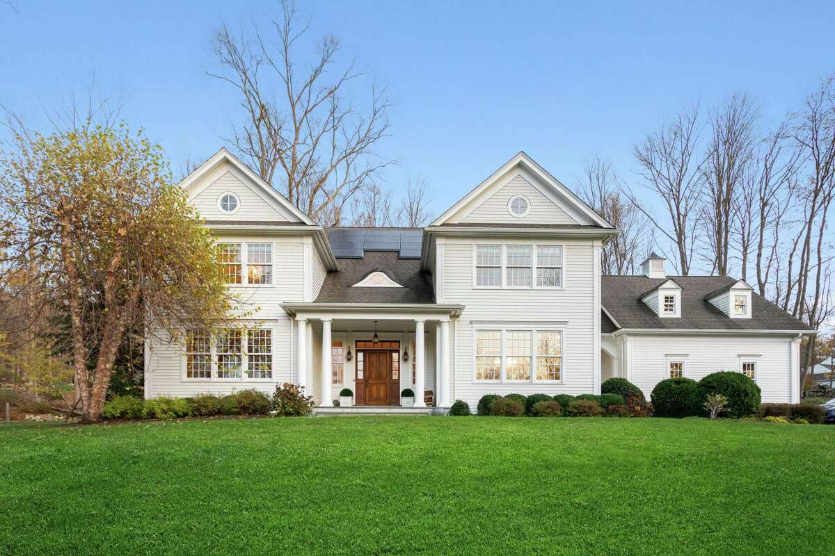 Colonial house at 3360 Sturges Highway, Fairfield with solar panels and other modern technology.