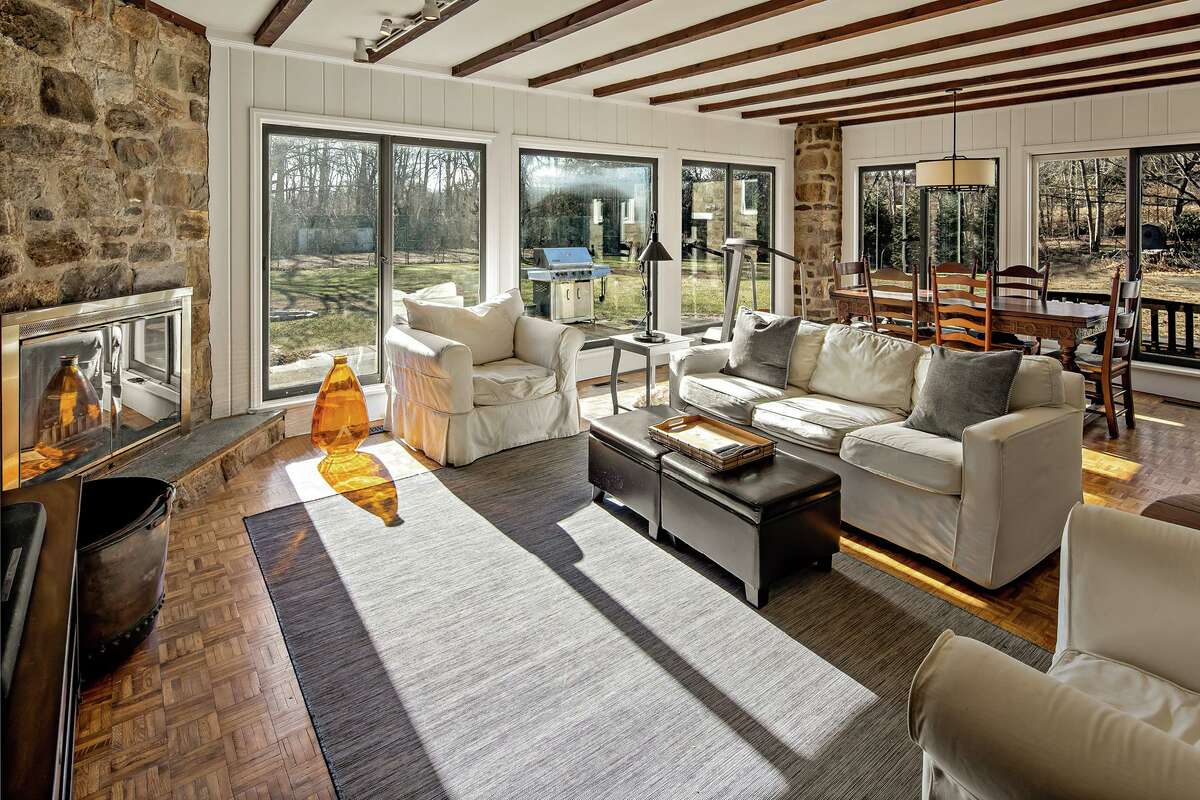 Family room with sliding door to the two-acre level property at 3 Kettle Creek Road, Weston.
