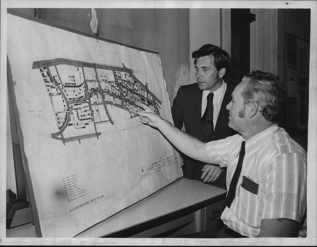 Richard Mullaney, attorney for Urban Renewal Association, and Donald Veitch, executive direcdtor of the Urban Renewal Agency, (seated) look over maps of the development of the Saratoga Springs City Center on Sept. 27, 1972 (Bud Hewig/Times Union Archive)