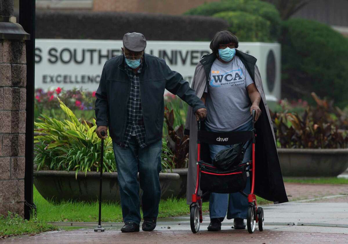 Gloria and Louis Ross leaving Texas Southern University after receiving free Pfizer COVID-19 vaccines Wednesday, Feb. 10, 2021, in Houston. The couple and a relative came to the Third Ward-based college around 5:30 a.m. in hope to receive the vaccines. Texas Southern University and Baylor-St. Luke’s Medical Center will officially launch a COVID-19 vaccination site next week.