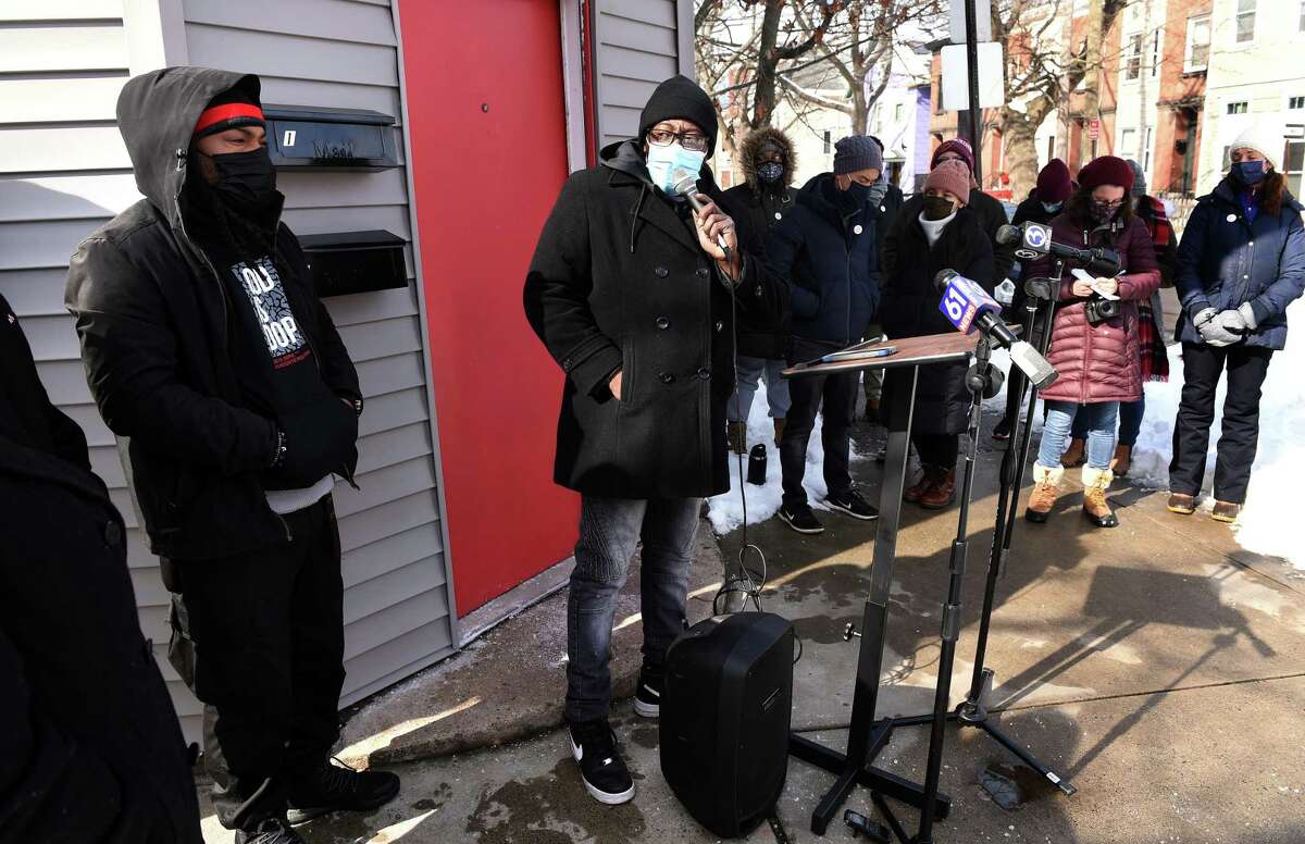 Ice the Beef Director Chaz Carmon, center, speaks at a vigil in honor of recent gun violence victims near the location of the shooting of Kevin Jiang on Lawrence Street in New Haven on Feb. 10, 2021.