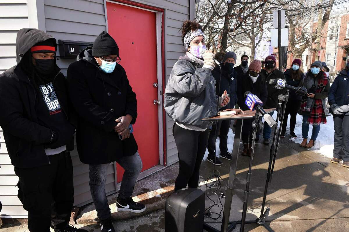 Ice the Beef member and neighborhood resident Natalia Katz, center, speaks at a vigil in honor of recent gun violence victims near the location of the shooting of Kevin Jiang on Lawrence Street in New Haven on Feb. 10, 2021.