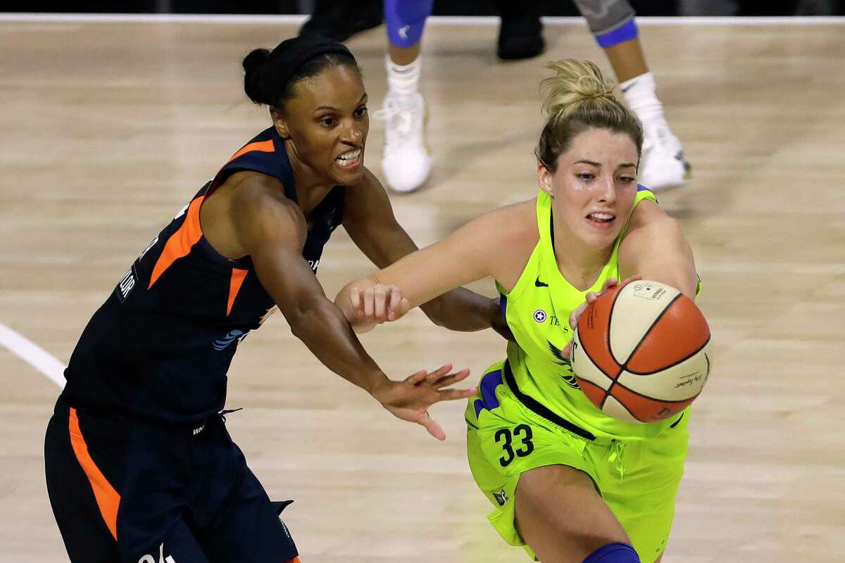 Connecticut Sun forward DeWanna Bonner (24) knocks the ball away from Dallas Wings guard Katie Lou Samuelson (33) during the first half of a WNBA basketball game Wednesday, Aug. 12, 2020, in Bradenton, Fla. (AP Photo/Chris O'Meara)