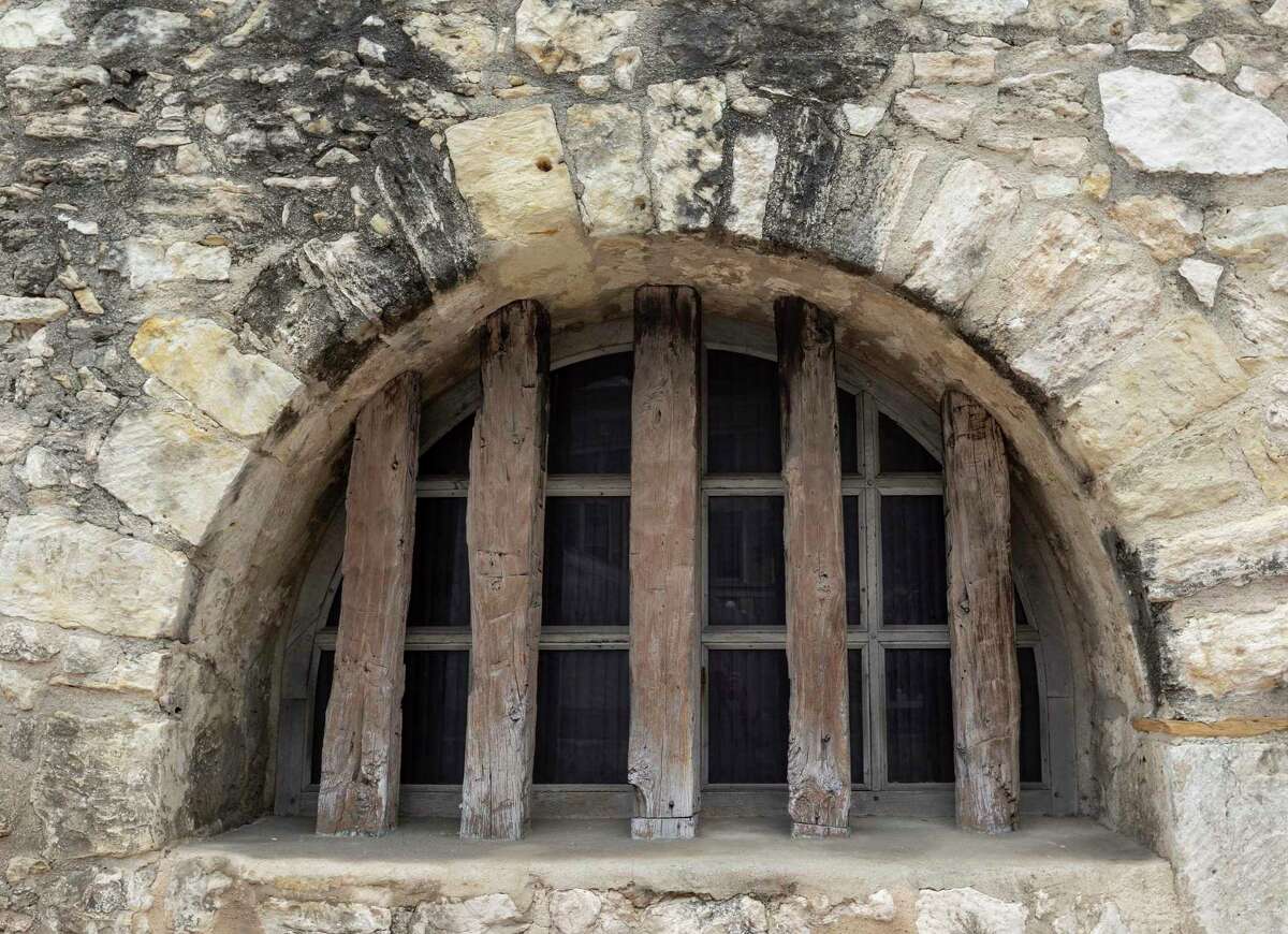 Darkened rock and mortar around a window on the Alamo long barracks west wall is seen Monday, Feb. 8, 2021. Conservators at the Alamo are preparing to clean the long barracks' west and south walls so they can assess the state of the underlying rocks and mortar.