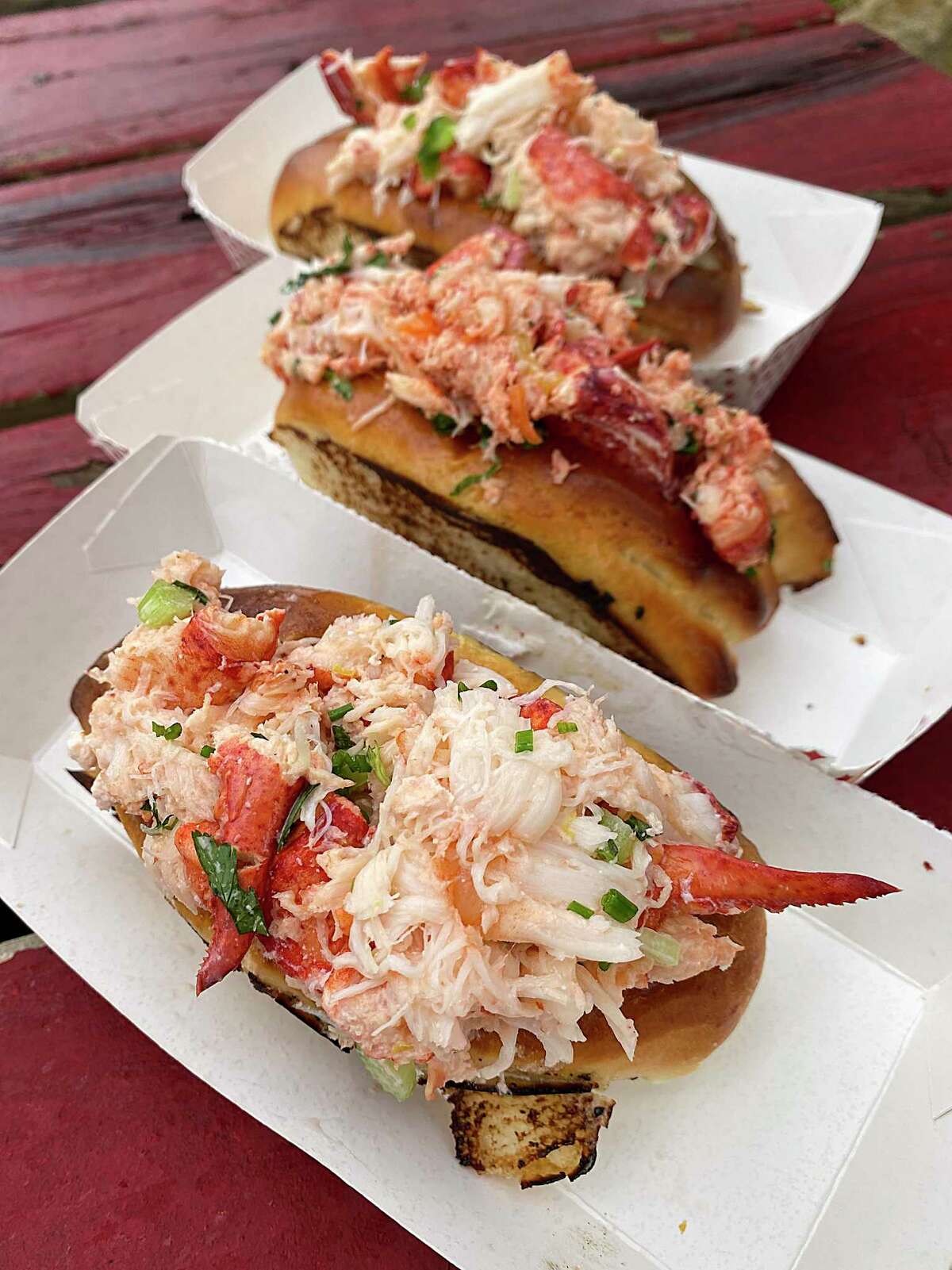 Lobster roll choices include, from the bottom, Maine Style (mayo, celery, tarragon), Island Breeze (mango, Scotch bonnet peppers) and St. Anthony (jalapeño, cilantro) at Masshole, a San Antonio food truck specializing in lobster rolls.