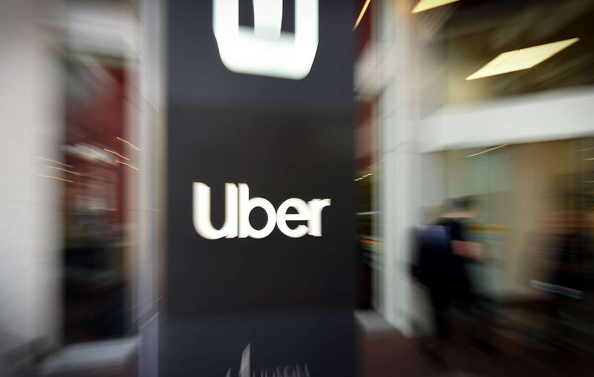 An Uber logo is seen outside the company's headquarters in San Francisco, California.
