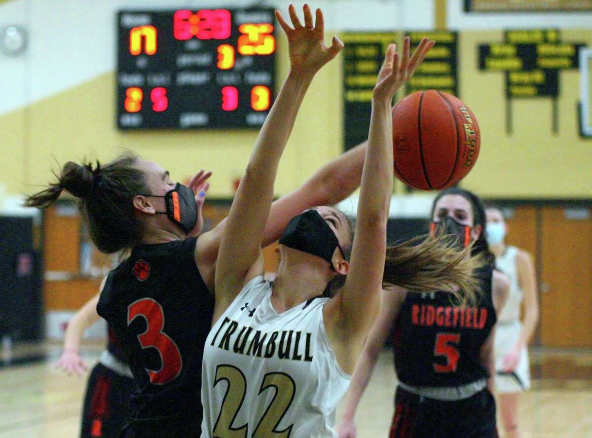 Ridgefied’s Kelly Chittenden (3) knocks the ball away from Trumbull’s Julia Lindwall as she attempts a shot in Wednesday’s game.